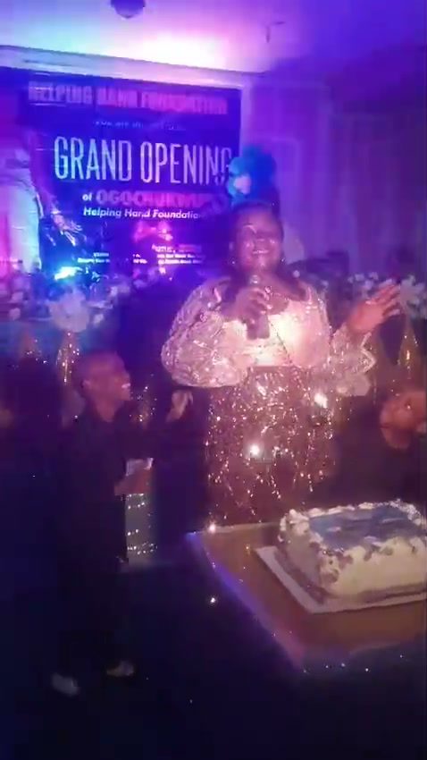 The grand opening of Ogochukwu Helping Hands Foundation, with the founder and children beside the cake