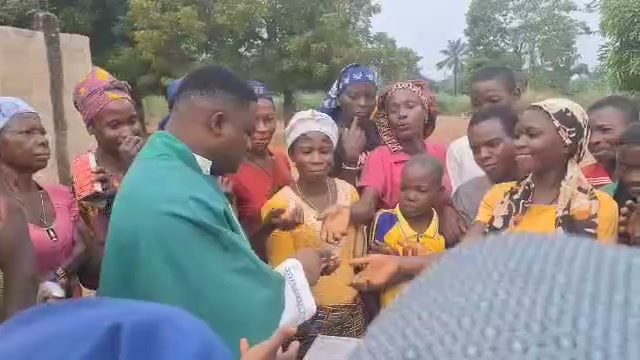 Older women and widows receiving provisions at a community distribution